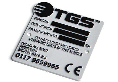 Custom relief moulded machine nameplate with black tipping