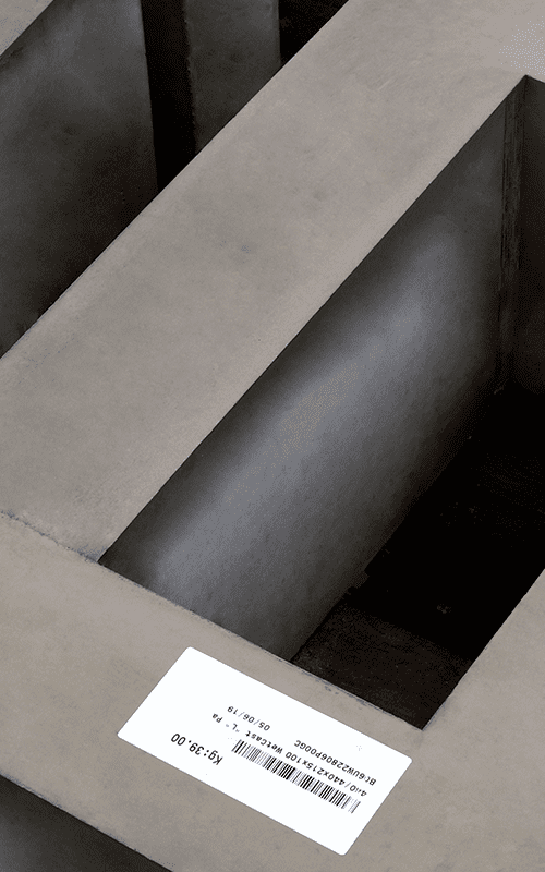 High Performance Self-Adhesives for Construction High tack self-adhesive on a stone block